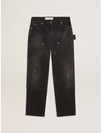 Jeans da donna in cotone di colore nero con effetto distressed con patch frontali