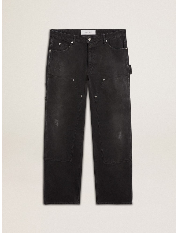 Jeans da uomo in cotone di colore nero effetto distressed con patch frontali