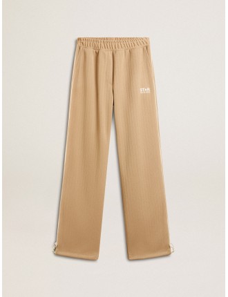 Pantalone jogging da donna di colore beige chiaro con logo bianco