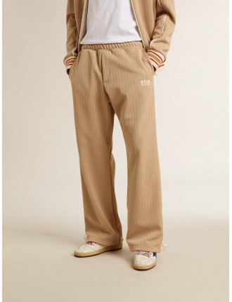 Pantalone jogging da uomo di colore beige chiaro con logo bianco